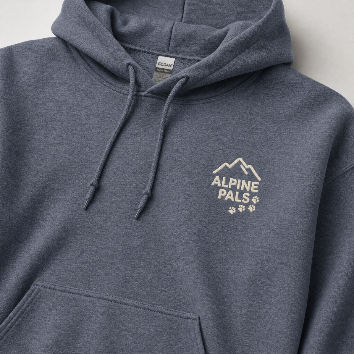 Heather sport dark navy hoodie with 'Alpine Pals' logo on a light gray background