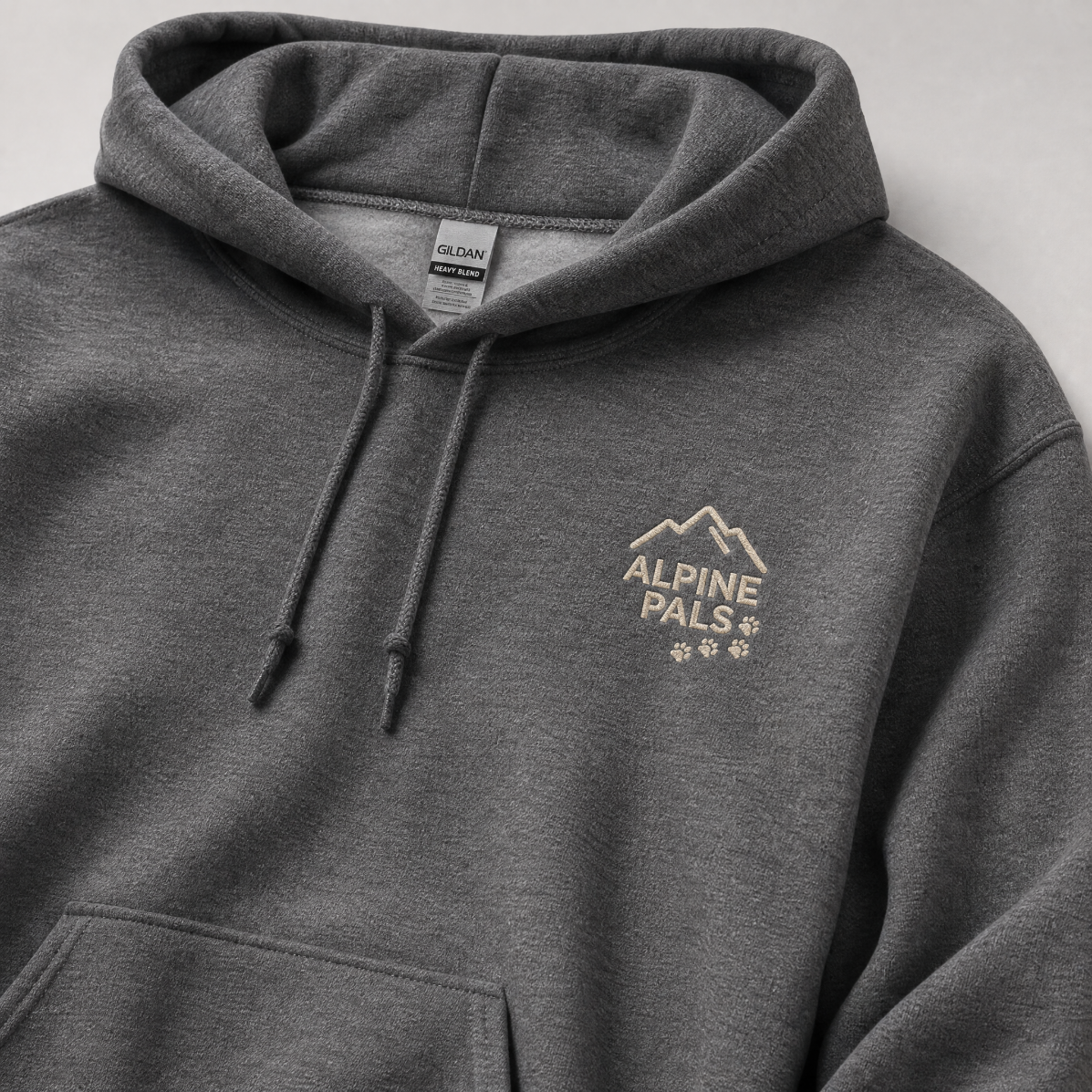 Graphite gray hoodie with 'Alpine Pals' logo on a light gray background