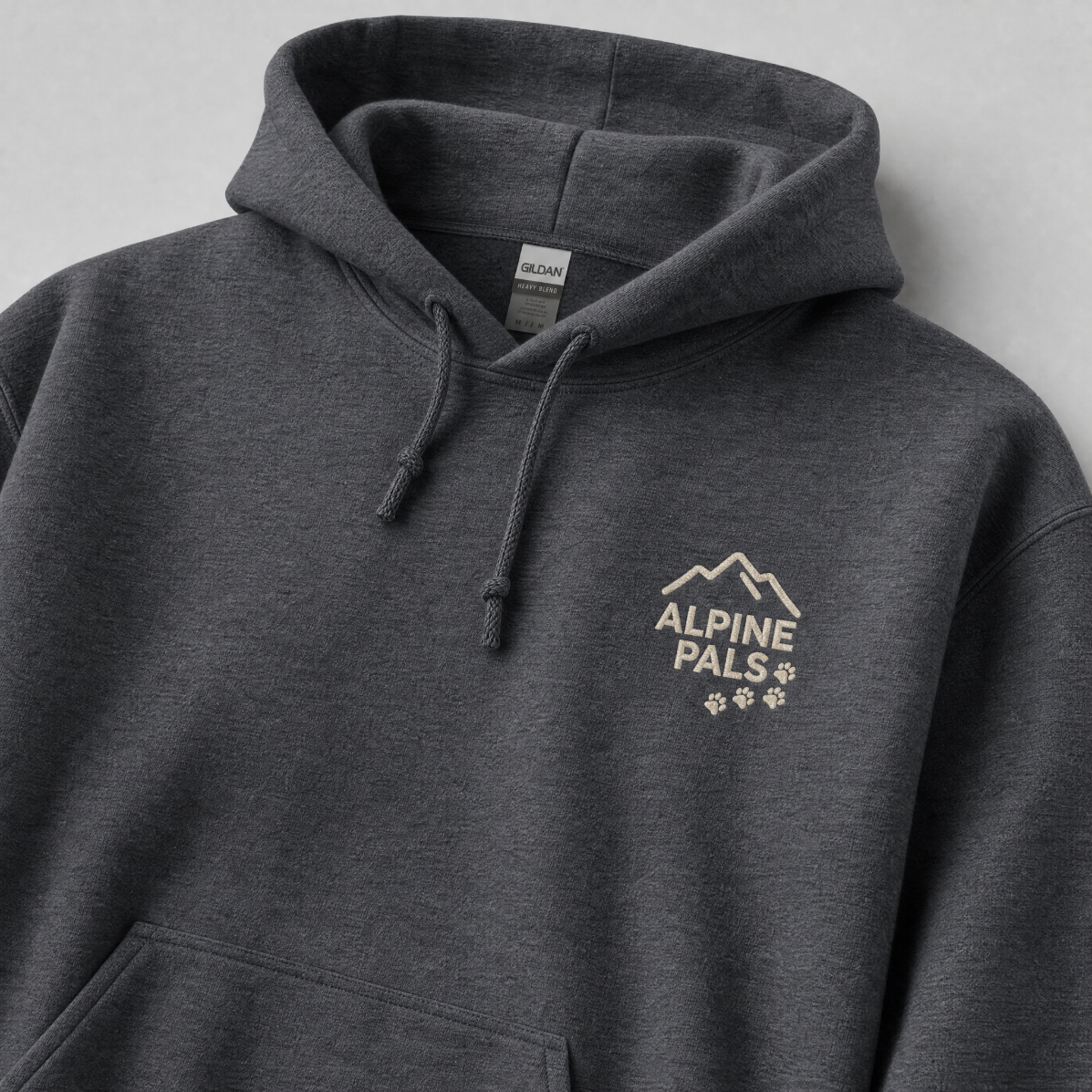 Dark heather gray hoodie with 'Alpine Pals' logo on a light gray background