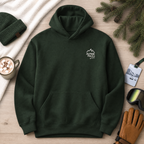 Forest green hoodie with 'Alpine Pals' logo on a wooden surface with winter accessories.