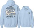 Light blue hoodie with a graphic of a dog by a window and 'Snowed In & Loving It' text on the back, with 'Alpine Pals' logo on the front.