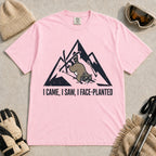 Blossom tee featuring a raccoon face-planting into the snow beneath a distressed mountain graphic with the phrase “I Came, I Saw, I Face-Planted.”