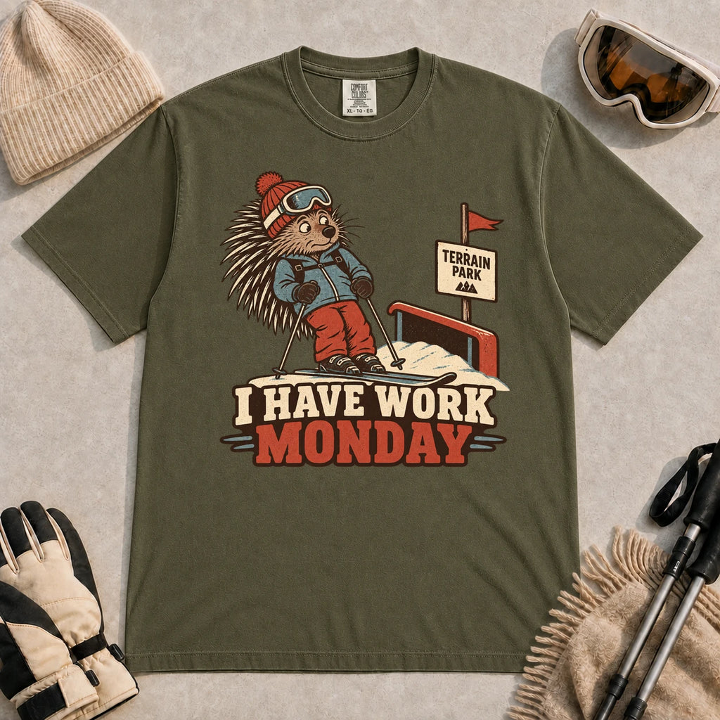 Hemp tee featuring a cautious porcupine skier beside a terrain park rail and sign above the phrase “I Have Work Monday.”