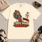Ivory tee featuring a cautious porcupine skier beside a terrain park rail and sign above the phrase “I Have Work Monday.”