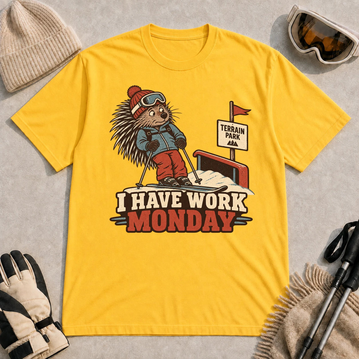 Daisy tee featuring a cautious porcupine skier beside a terrain park rail and sign above the phrase “I Have Work Monday.”