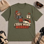 Military Green tee featuring a cautious porcupine skier beside a terrain park rail and sign above the phrase “I Have Work Monday.”
