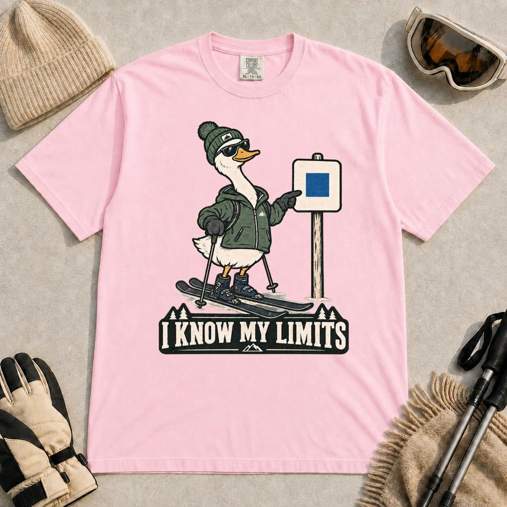 Blossom tee featuring a cool duck skier pointing to a blue-square trail sign above the phrase “I Know My Limits.”