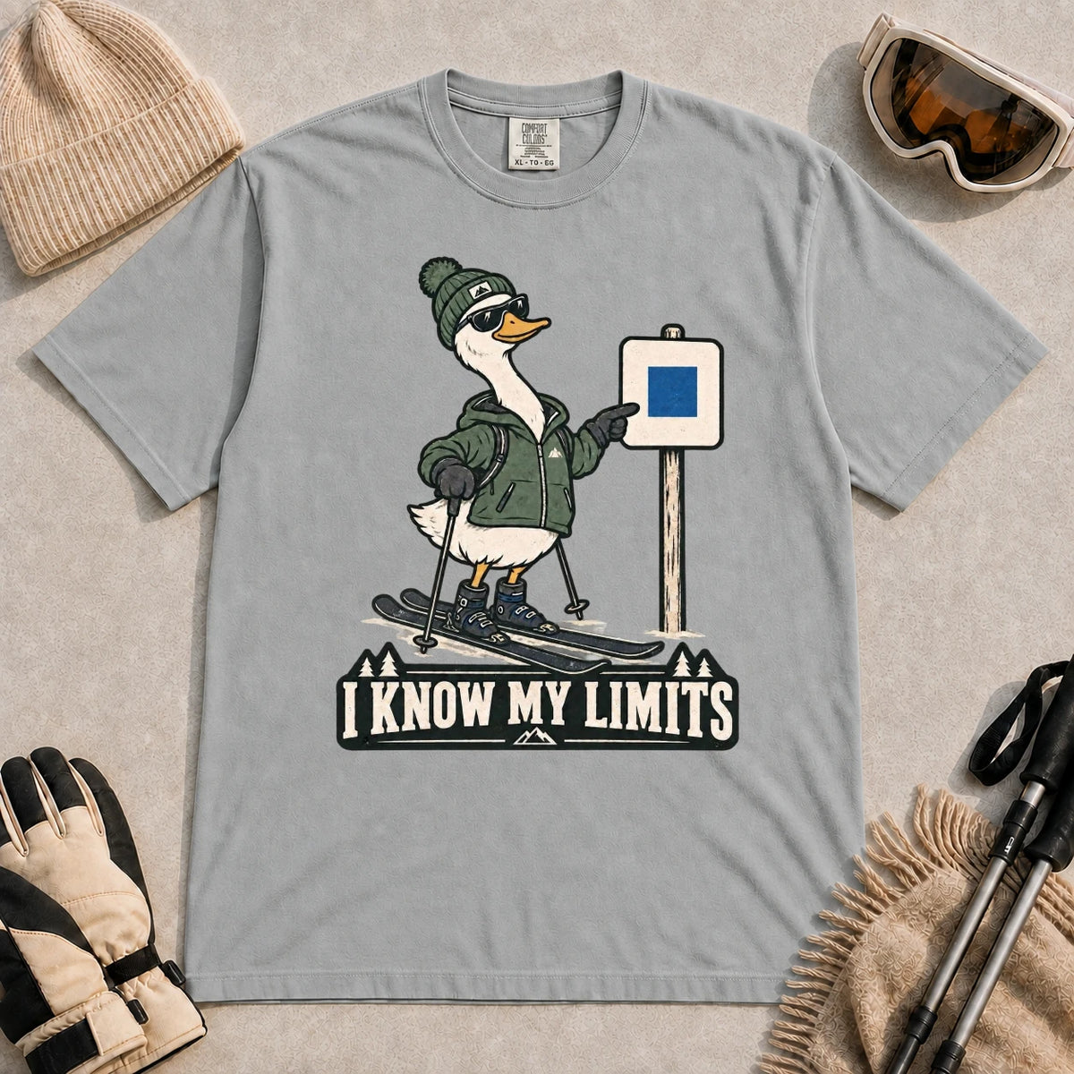 Granite tee featuring a cool duck skier pointing to a blue-square trail sign above the phrase “I Know My Limits.”