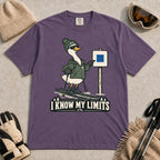 Grape tee featuring a cool duck skier pointing to a blue-square trail sign above the phrase “I Know My Limits.”