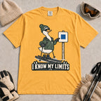 Mustard tee featuring a cool duck skier pointing to a blue-square trail sign above the phrase “I Know My Limits.”