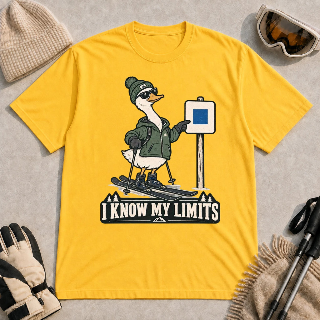Daisy tee featuring a cool duck skier pointing to a blue-square trail sign above the phrase “I Know My Limits.”