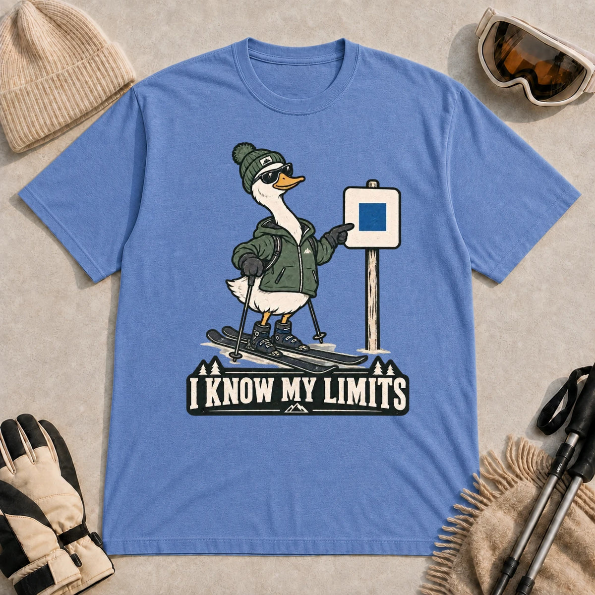 Heather Royal tee featuring a cool duck skier pointing to a blue-square trail sign above the phrase “I Know My Limits.”