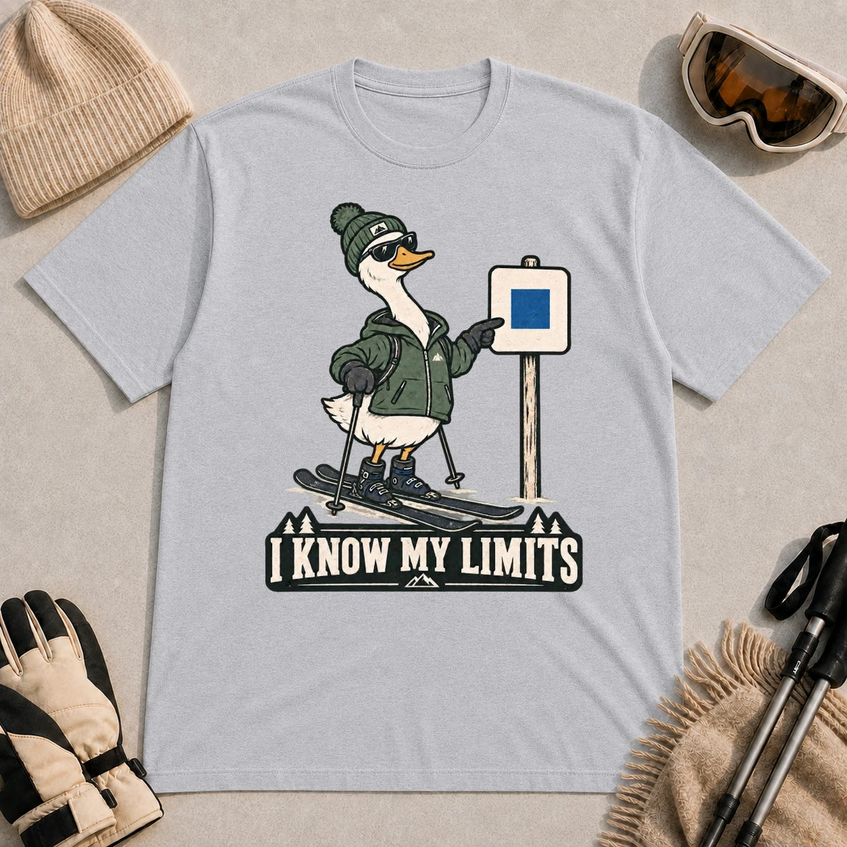 Sport Grey tee featuring a cool duck skier pointing to a blue-square trail sign above the phrase “I Know My Limits.”