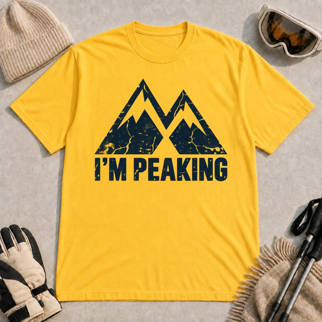 Daisy tee featuring a distressed navy double-mountain graphic above the phrase “I’m Peaking.”