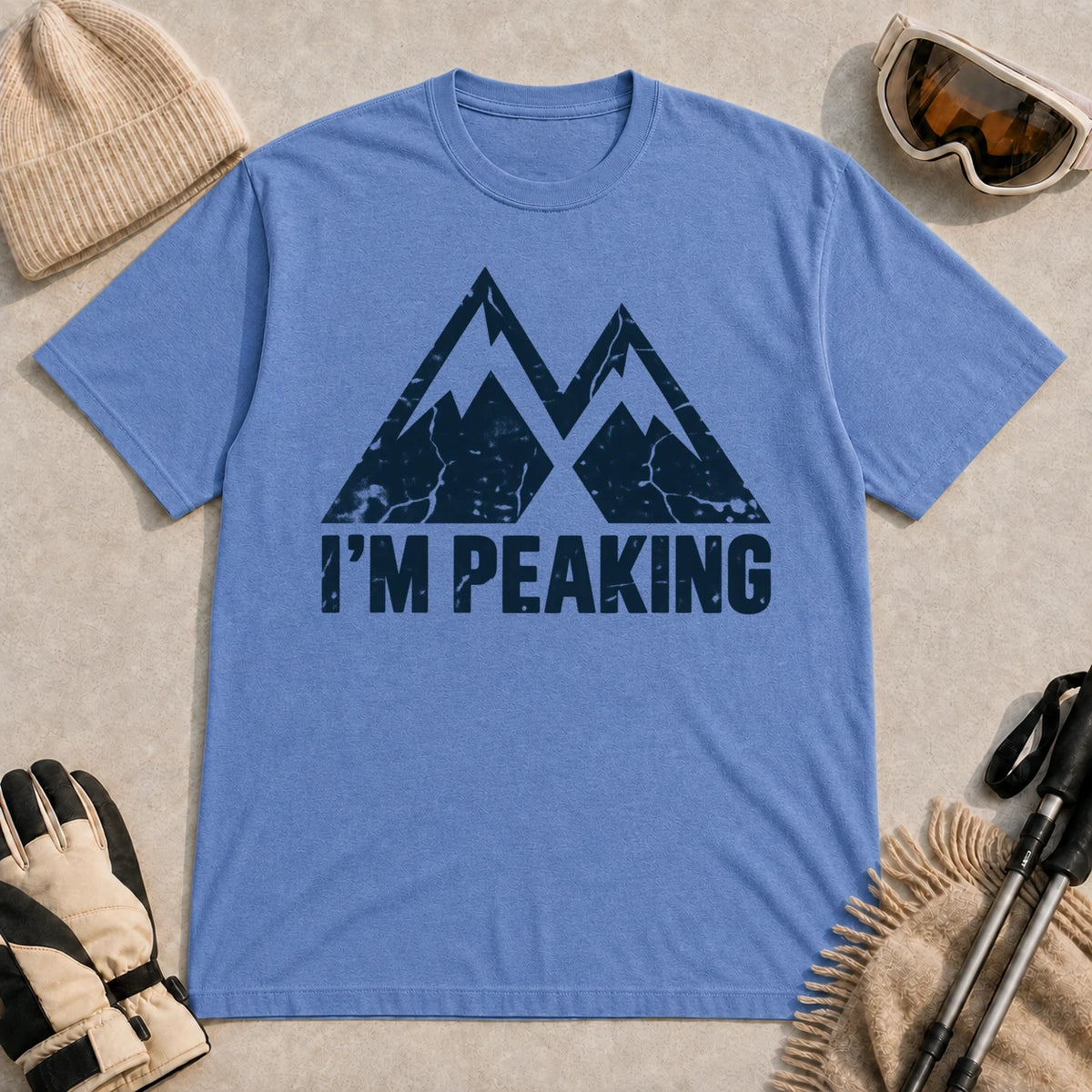 Heather Royal tee featuring a distressed navy double-mountain graphic above the phrase “I’m Peaking.”