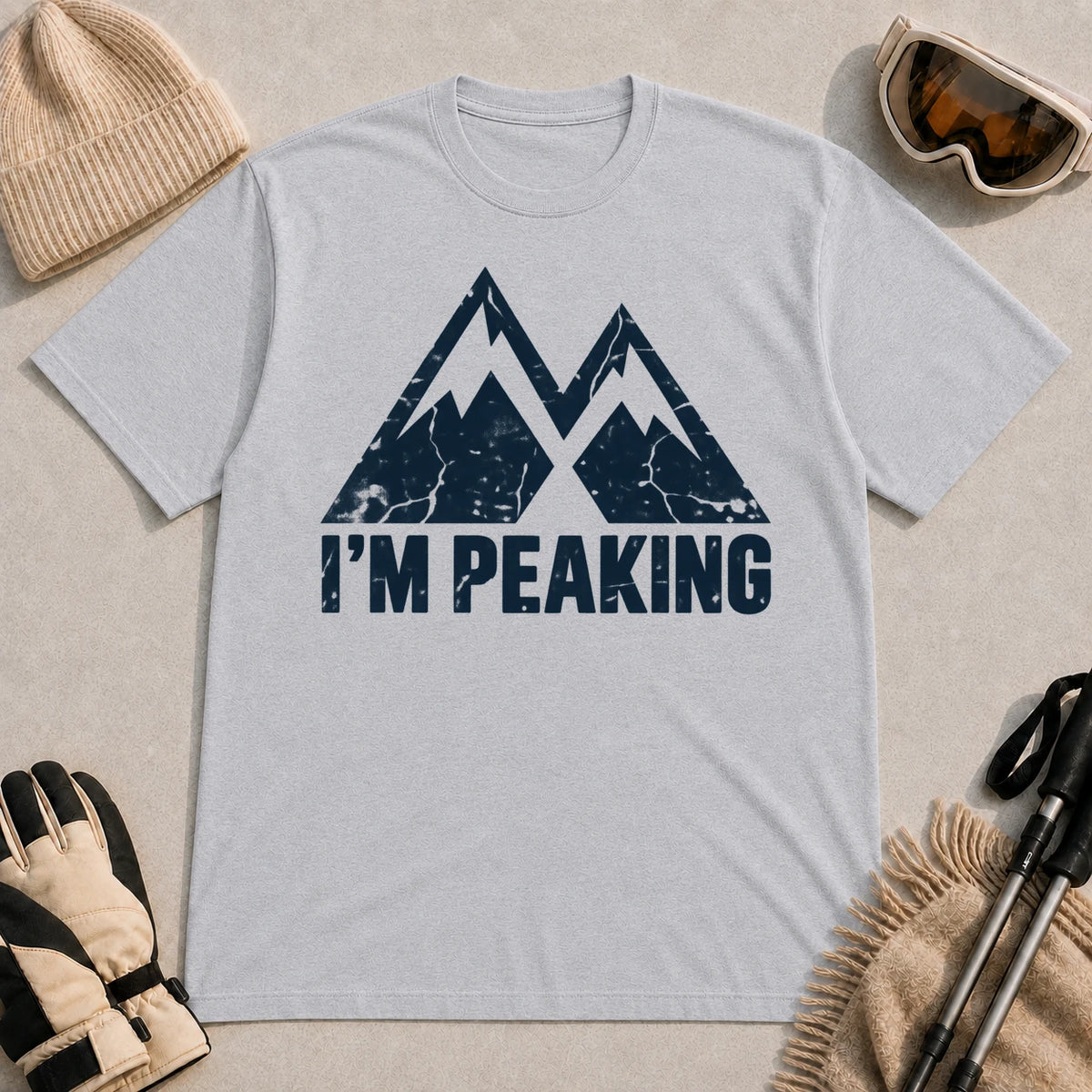 Sport Grey tee featuring a distressed navy double-mountain graphic above the phrase “I’m Peaking.”