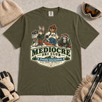 Hemp tee featuring a bear, bunny, and raccoon in ski gear above a retro “Mediocre Ski Club” badge with the phrases “Proudly Intermediate” and “Blues, Brews, and Back by 4.”