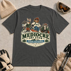 Dark Heather Gray tee featuring a bear, bunny, and raccoon in ski gear above a retro “Mediocre Ski Club” badge with the phrases “Proudly Intermediate” and “Blues, Brews, and Back by 4.”