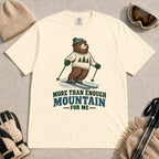 Ivory tee featuring a smiling bear skiing in retro mountain gear above the phrase “More Than Enough Mountain for Me.”