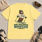 Cornsilk tee featuring a smiling bear skiing in retro mountain gear above the phrase “More Than Enough Mountain for Me.”
