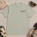 Bay tee featuring minimalist black line art of a bear, raccoon, and bunny wearing ski goggles above a small pair of crossed skis.