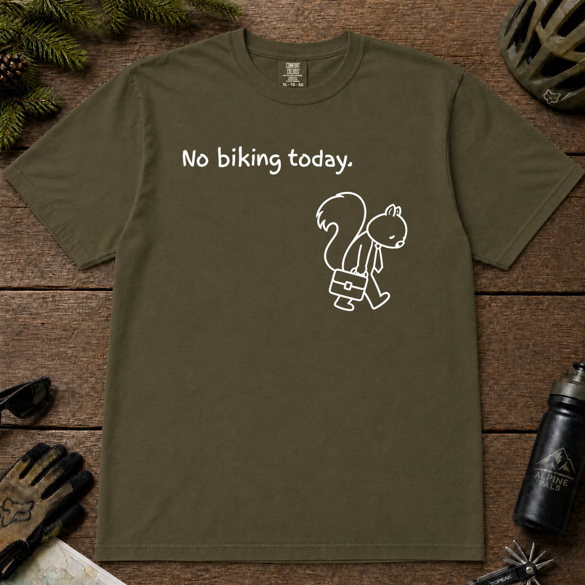 Hemp tee featuring a sad squirrel dressed for work and carrying a briefcase beneath the phrase “No biking today.”