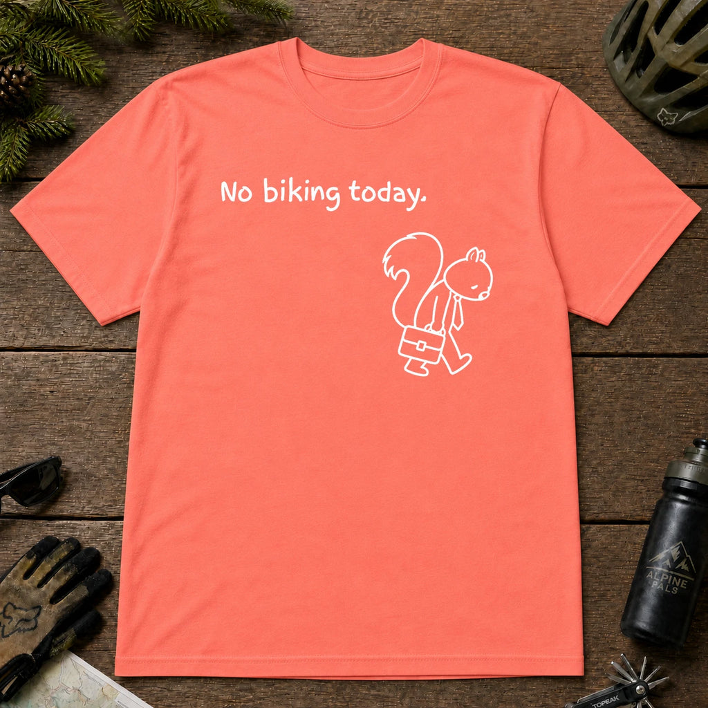 Coral Silk tee featuring a sad squirrel dressed for work and carrying a briefcase beneath the phrase “No biking today.”