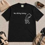 Black tee featuring a sad bear dressed for work and carrying a briefcase beneath the phrase “No skiing today.”