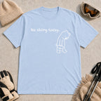 Light Blue tee featuring a sad bear dressed for work and carrying a briefcase beneath the phrase “No skiing today.”