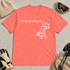 Coral Silk tee featuring a sad raccoon dressed for work and carrying a briefcase beneath the phrase “No snowboarding today.”