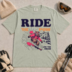 Bay tee featuring a bear snowboarding through powder in a retro mountain scene with the phrases “Ride the Pow” and “Live the Dream.”