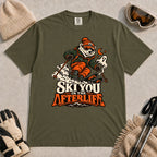 Hemp tee featuring a polar bear skiing through a spooky Halloween scene with a ghost and crescent moon above the phrase “Ski You in the Afterlife.”