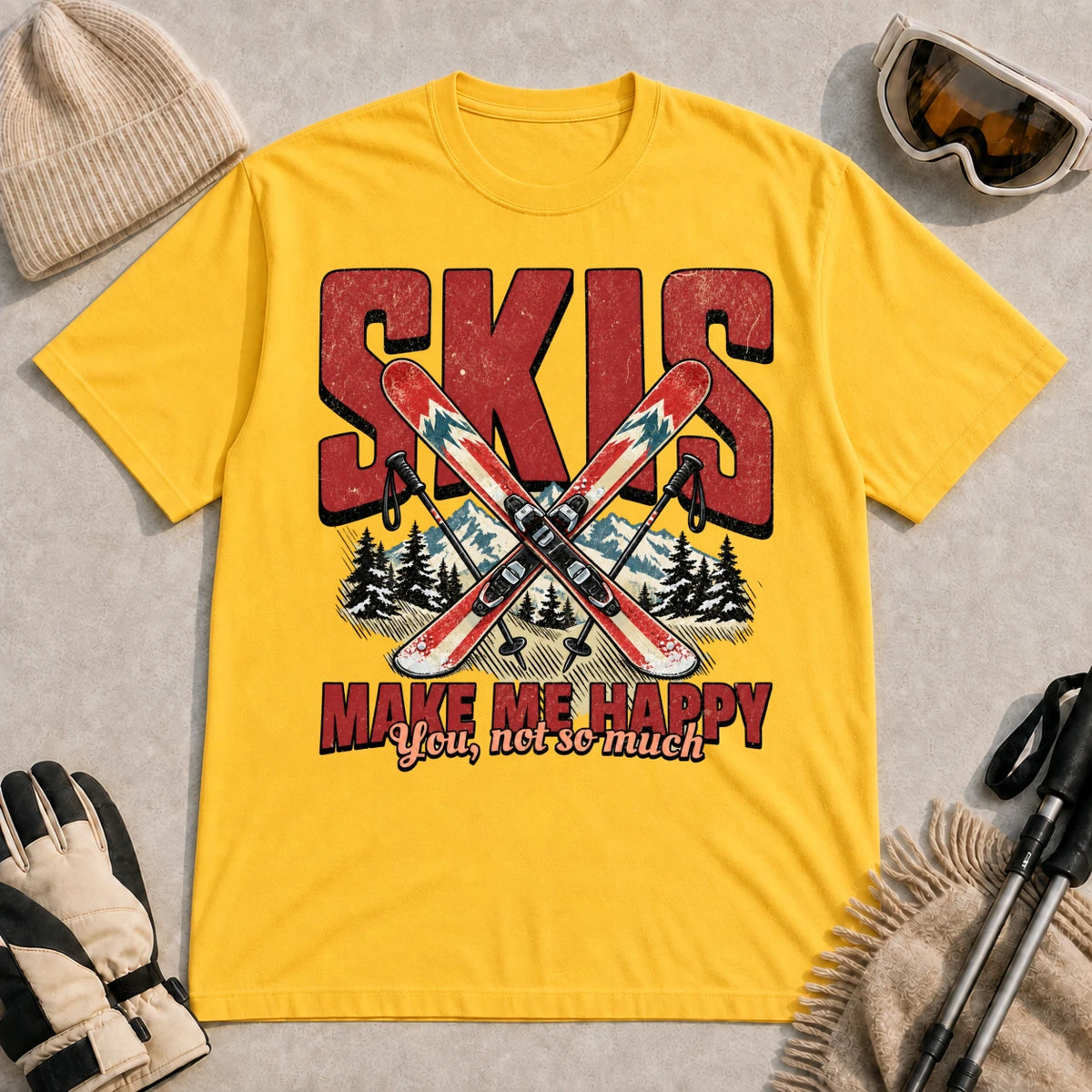 Daisy tee featuring crossed skis and poles in front of bold retro “Skis” lettering with the phrase “Make Me Happy, You Not So Much.”