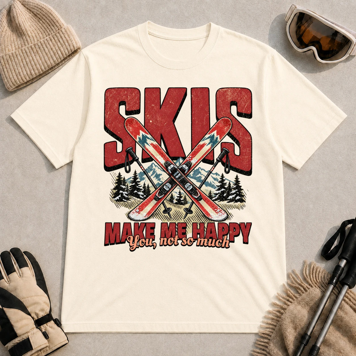 Natural tee featuring crossed skis and poles in front of bold retro “Skis” lettering with the phrase “Make Me Happy, You Not So Much.”