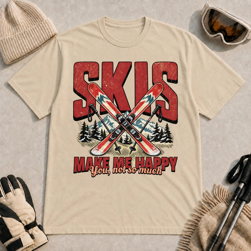 Sand tee featuring crossed skis and poles in front of bold retro “Skis” lettering with the phrase “Make Me Happy, You Not So Much.”