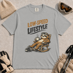 Granite t-shirt featuring a vintage sloth wearing ski goggles and relaxing in a rocking chair with a hot drink, with the phrase “Low-Speed Lifestyle.”