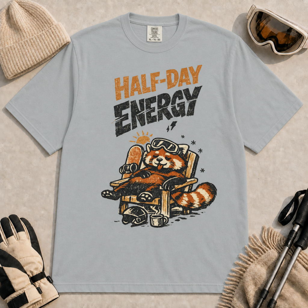 Granite tee featuring a relaxed red panda lounging in a chair with snowboard gear and the phrase “Half-Day Energy.”