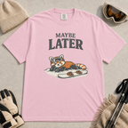 Blossom t-shirt featuring a relaxed red panda lying in the snow beside a snowboard, wearing ski goggles beneath the phrase “Maybe Later.”