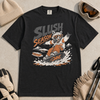 Black t-shirt with 'Slush Season' graphic featuring a raccoon snowboarding, surrounded by winter accessories on a light gray background.