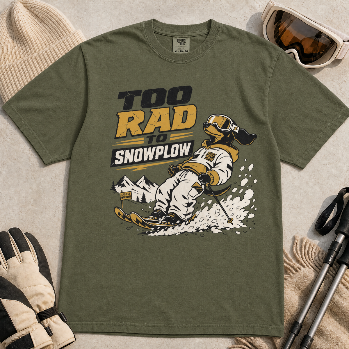 Hemp green t-shirt with snowplowing graphic and text 'Too Rad to Snowplow' on a light background.