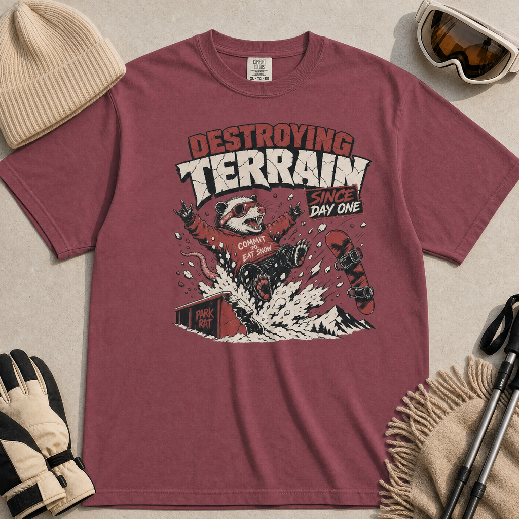 Brick red t-shirt with a graphic of a snowboarding possum and text on a red background