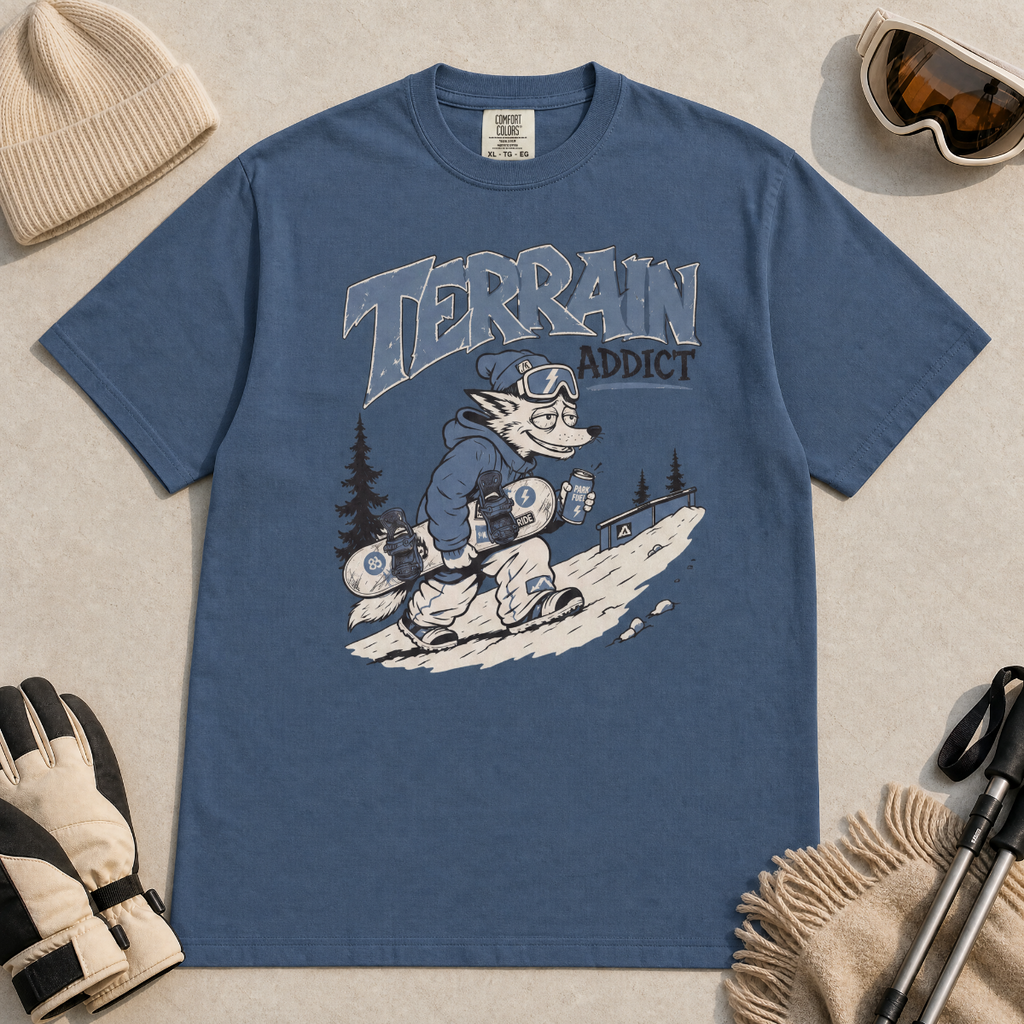 Midnight blue t-shirt with 'Terrain Addict' graphic on a light gray surface with winter accessories.
