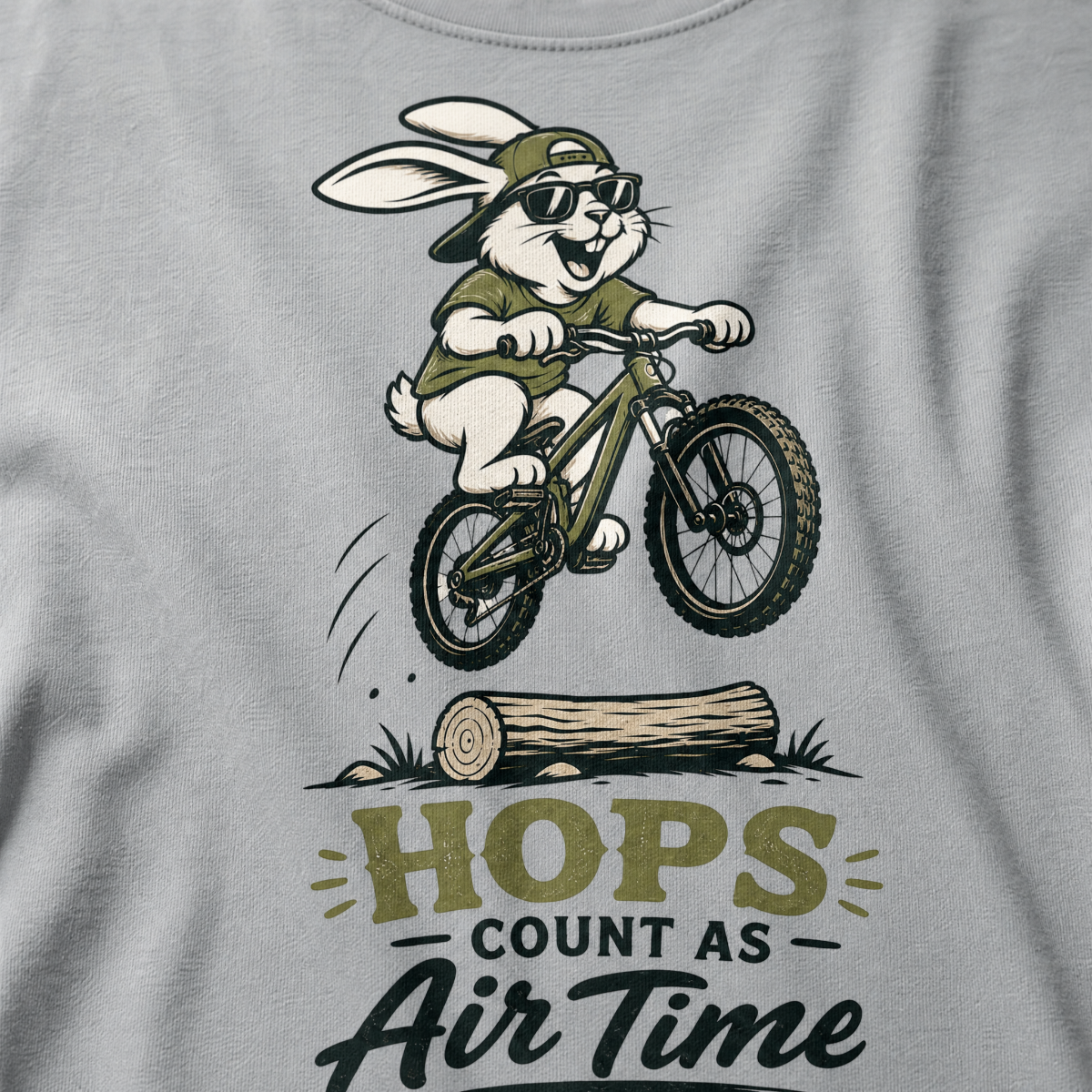 Granite gray t-shirt with a graphic of a rabbit riding a bike and text 'HOPS COUNT AS AIR TIME'.