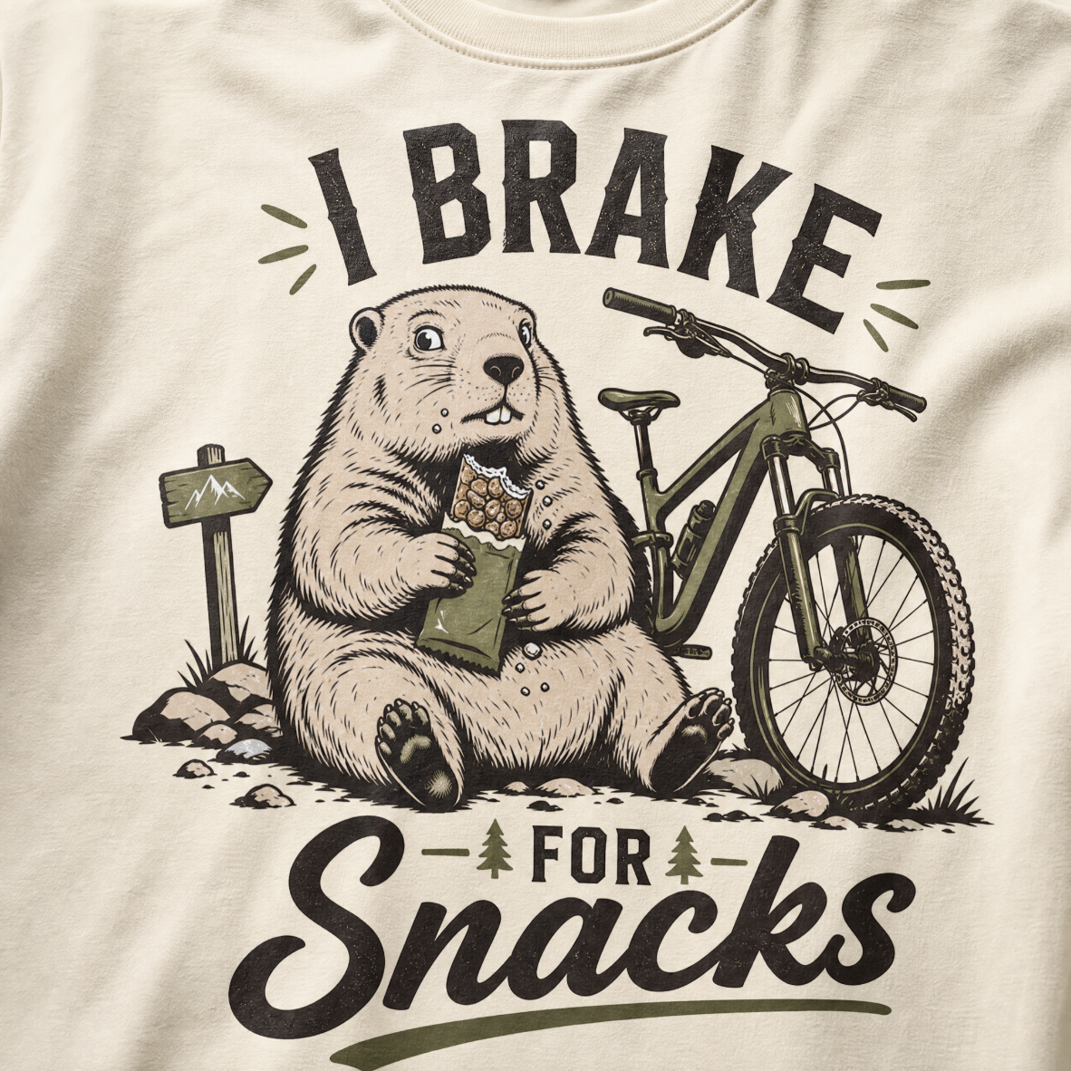 Ivory white colored t-shirt with 'I Brake For Snacks' text and a marmot eating a bar with a mountain bike on the side.