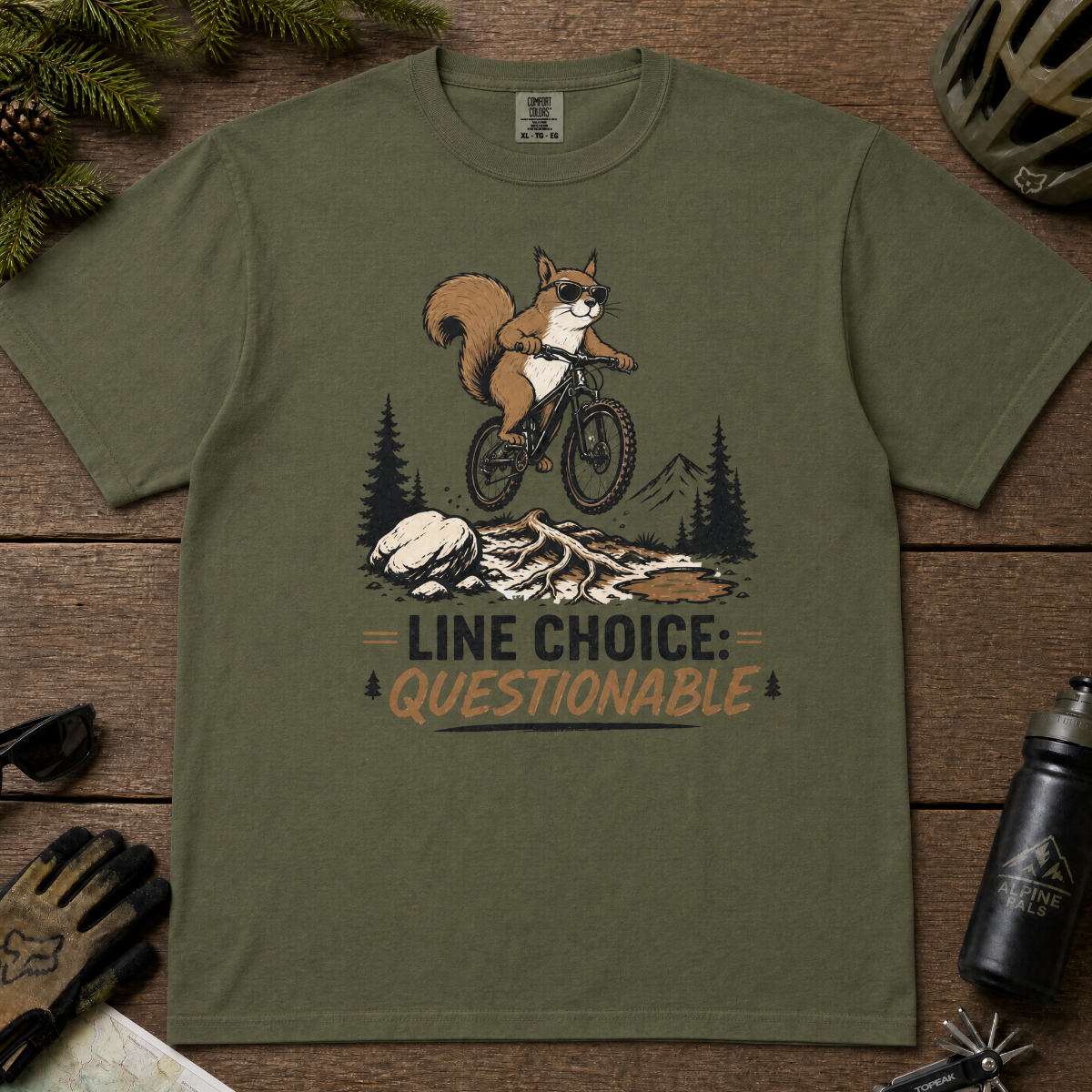 Hemp green t-shirt with a graphic of a squirrel on a bike and text 'Line Choice: Questionable'.