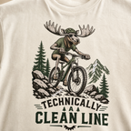 Ivory white t-shirt with a graphic of a moose riding a bike and text 'Technically A Clean Line'.