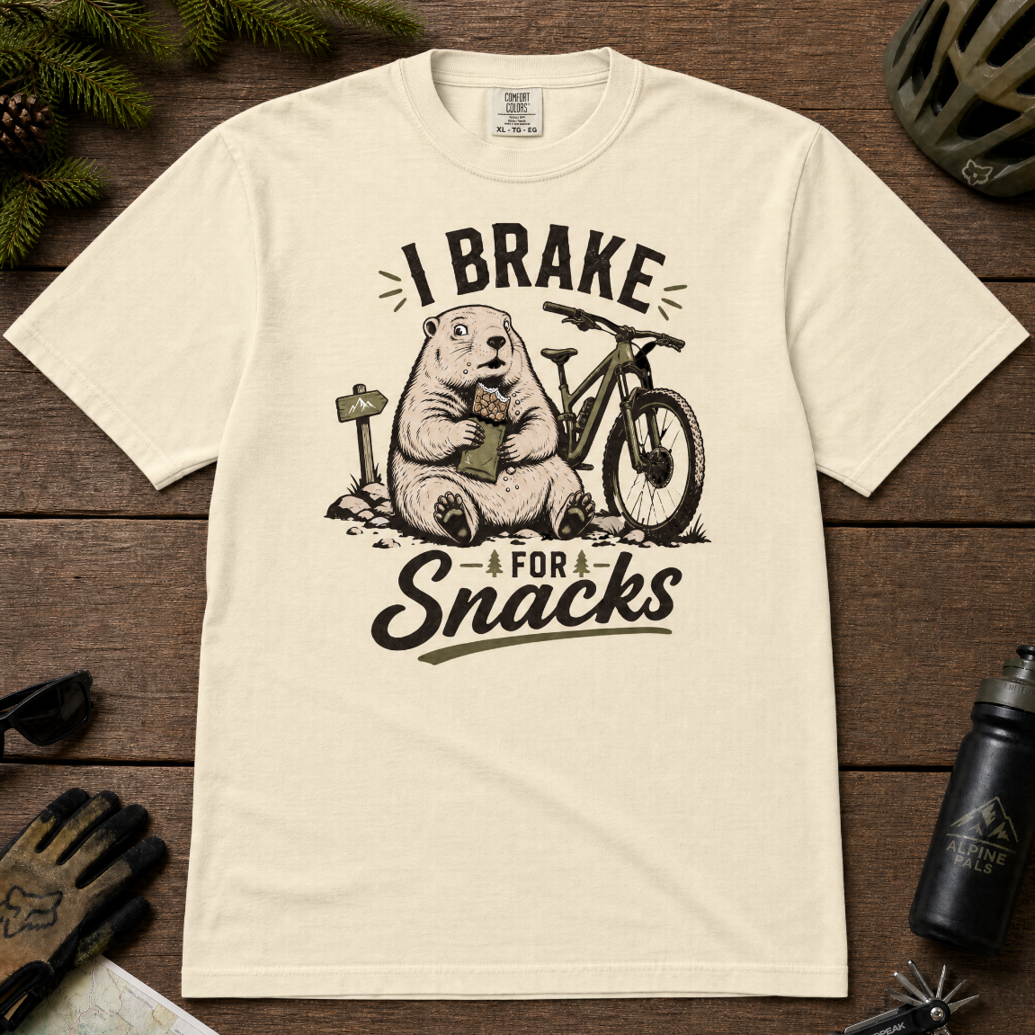 Ivory white t-shirt with a marmot graphic and text 'I Brake for Snacks'.