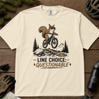 Ivory white t-shirt with a graphic of a squirrel on a bike and text 'Line Choice: Questionable'.