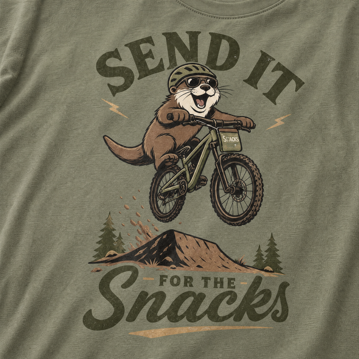 Moss green t-shirt with a graphic of an otter on a bike and text 'Send it for the snacks'.