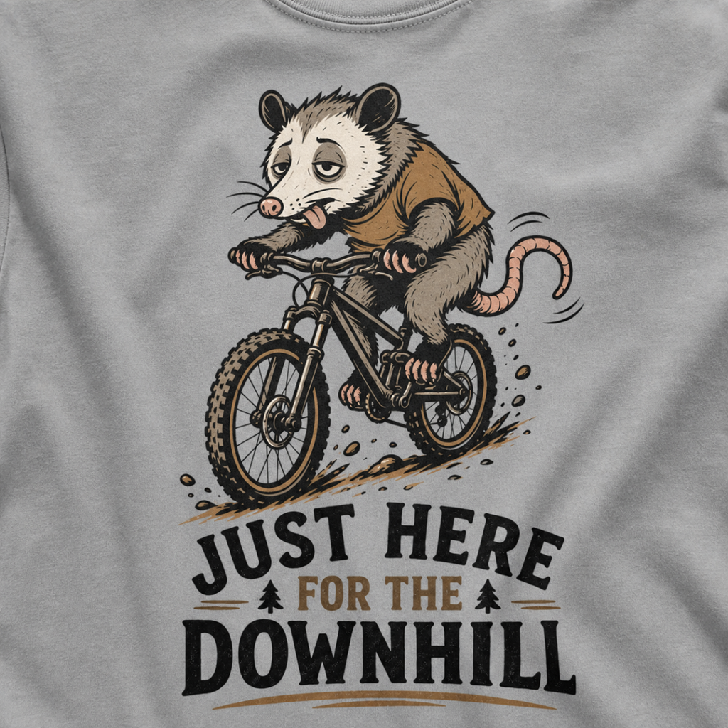 Granite gray t-shirt with an opossum riding a bike graphic and text 'Just Here for the Downhill'.